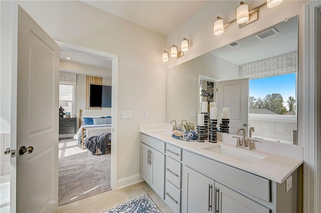 82 Sheryl Way, Loganville, GA 30052 - full bath with ensuite bath, double vanity, and tile patterned floors