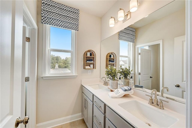 82 Sheryl Way, Loganville, GA 30052 - bathroom featuring double vanity and tile patterned flooring