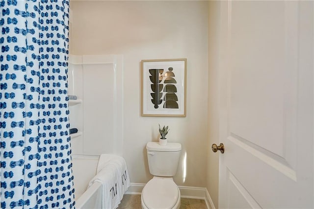 82 Sheryl Way, Loganville, GA 30052 - bathroom featuring baseboards and shower / tub combo with curtain