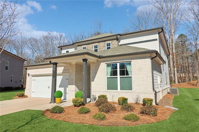 view of front of home featuring a garage, driveway, cooling unit, a front yard, and brick siding