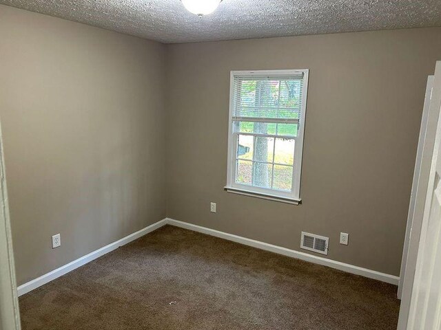1106 Hardy Cir, Dallas, GA 30157 - carpeted empty room featuring a textured ceiling, baseboards, and visible vents