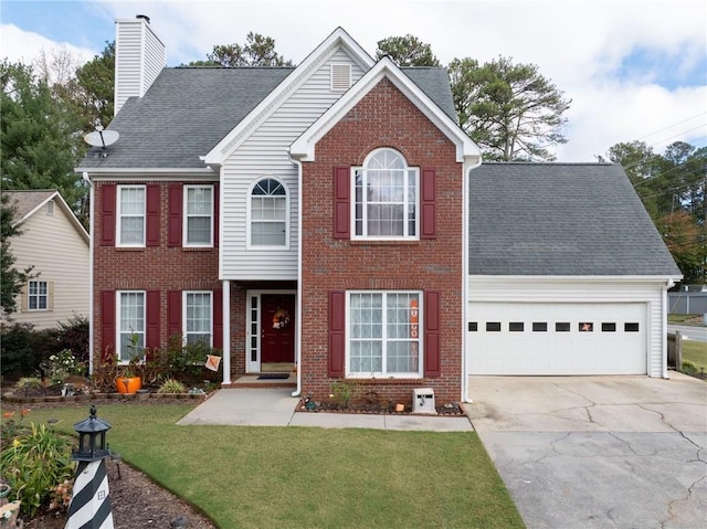 colonial inspired home featuring a front yard, brick siding, concrete driveway, and an attached garage