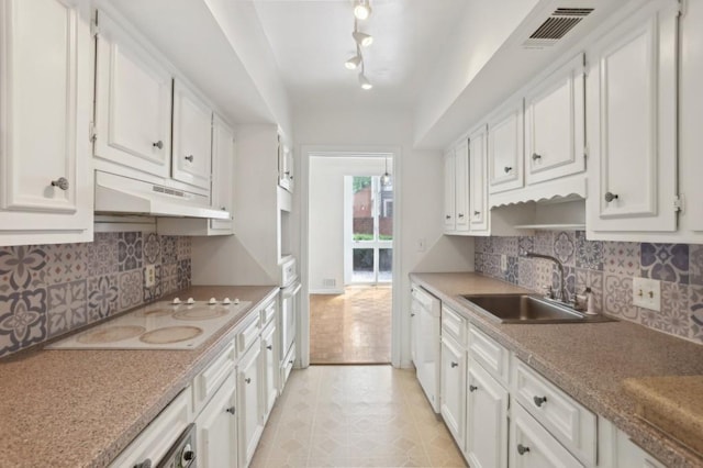 49 Willow Gln, Atlanta, GA 30342 - kitchen featuring a sink, under cabinet range hood, and white cabinets