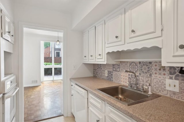 49 Willow Gln, Atlanta, GA 30342 - kitchen with white appliances, a sink, white cabinets, and tasteful backsplash