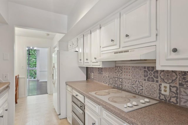 49 Willow Gln, Atlanta, GA 30342 - kitchen featuring under cabinet range hood, white appliances, white cabinets, tasteful backsplash, and light countertops