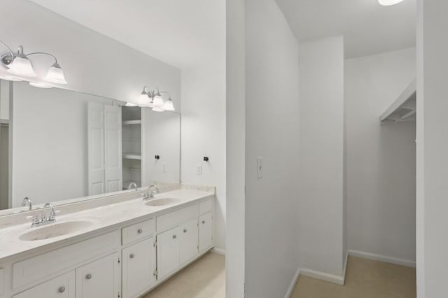 49 Willow Gln, Atlanta, GA 30342 - bathroom with double vanity, a closet, and baseboards