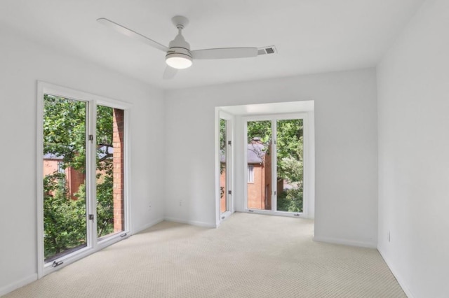 49 Willow Gln, Atlanta, GA 30342 - empty room featuring carpet, plenty of natural light, a ceiling fan, and baseboards