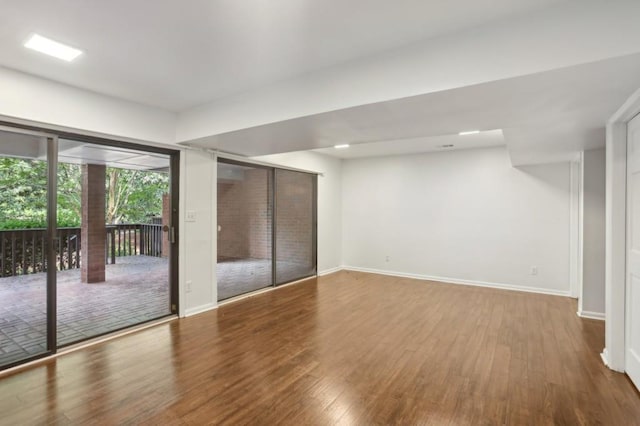 49 Willow Gln, Atlanta, GA 30342 - unfurnished bedroom featuring baseboards, access to outside, and wood finished floors
