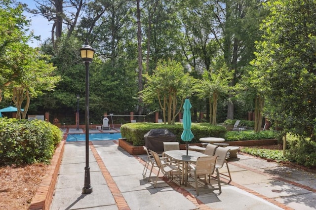 49 Willow Gln, Atlanta, GA 30342 - view of patio with an outdoor pool and outdoor dining area