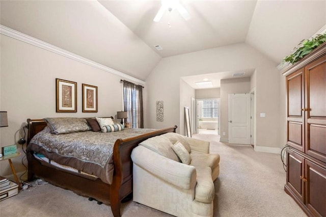 bedroom featuring connected bathroom, ceiling fan, light colored carpet, and vaulted ceiling