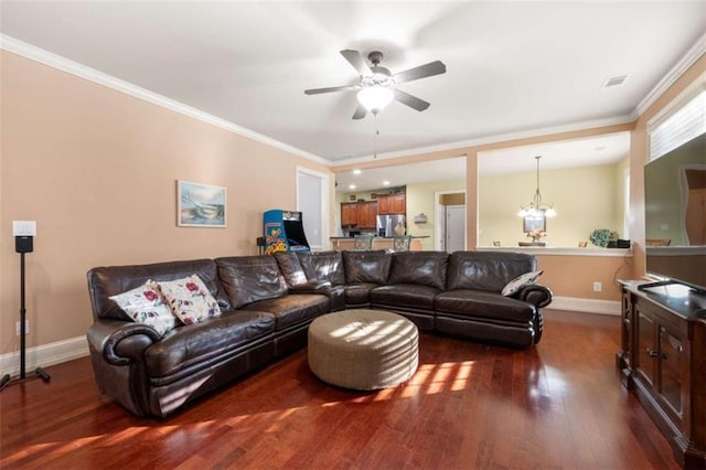 living room featuring ceiling fan with notable chandelier, dark hardwood / wood-style flooring, and crown molding