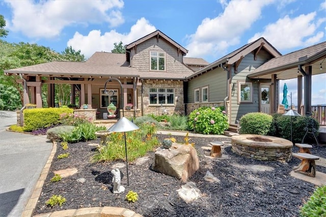 52 Waterside Dr SE, Cartersville, GA 30121 - back of property featuring a fire pit and stone siding