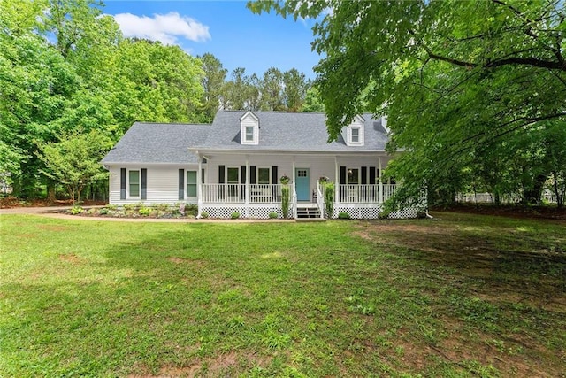 cape cod-style house featuring covered porch and a front yard
