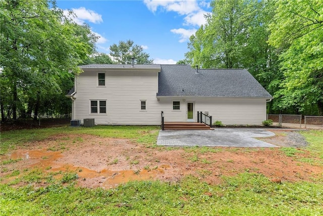 rear view of property featuring a patio area, cooling unit, and a wooden deck
