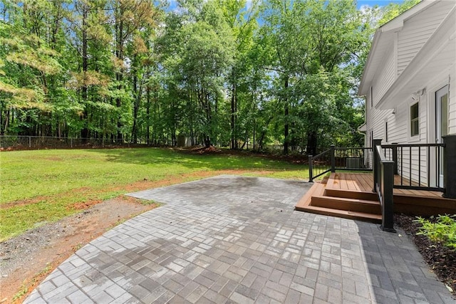 view of patio / terrace with a deck and view of scattered trees