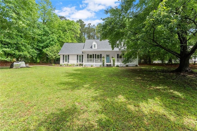 view of front of property featuring covered porch and a front yard