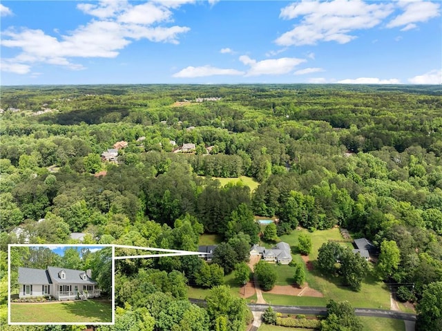 view of property location featuring a heavily wooded area and property parcel outlined