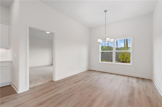 1216 Cedarcrest Blvd, Acworth, GA 30101 - unfurnished dining area featuring baseboards, a chandelier, and light wood finished floors