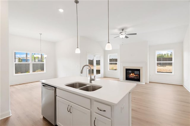 1216 Cedarcrest Blvd, Acworth, GA 30101 - kitchen featuring dishwasher, a healthy amount of sunlight, a sink, light wood-style flooring, and open floor plan
