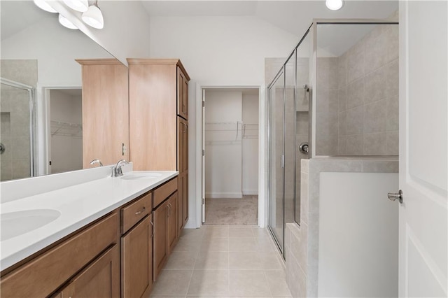 1216 Cedarcrest Blvd, Acworth, GA 30101 - full bathroom with a spacious closet, tile patterned floors, a sink, and a shower stall