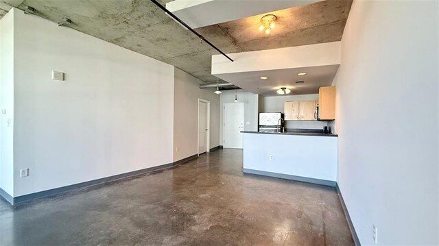 kitchen with white refrigerator and light brown cabinets