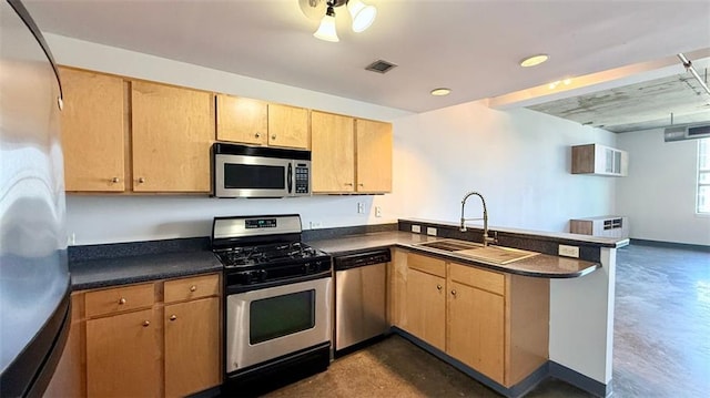 kitchen featuring light brown cabinetry, sink, appliances with stainless steel finishes, and kitchen peninsula