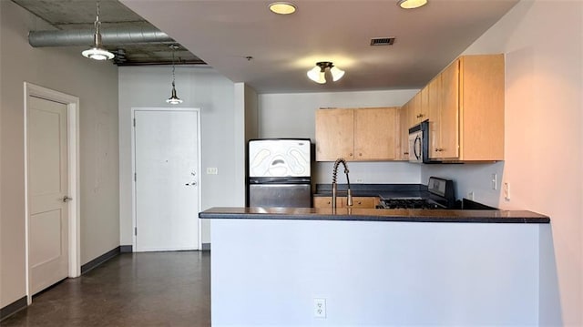 kitchen featuring light brown cabinets, kitchen peninsula, stainless steel appliances, sink, and decorative light fixtures