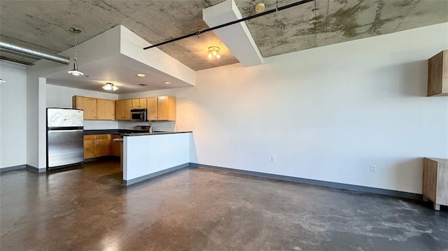 kitchen with decorative light fixtures, stainless steel appliances, and radiator heating unit