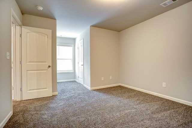 spare room with carpet