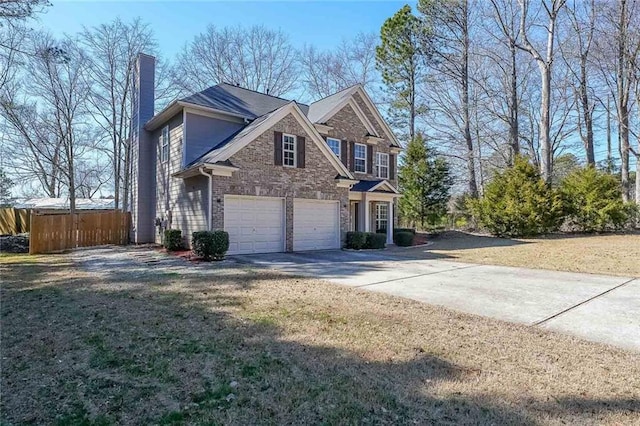 view of front of property featuring driveway, a garage, a chimney, fence, and brick siding