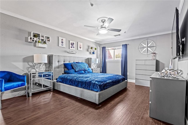 bedroom featuring crown molding, dark wood-type flooring, and ceiling fan