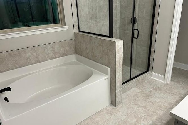 bathroom featuring vanity and plus walk in shower