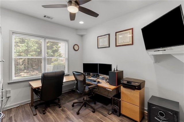 office space featuring visible vents, wood finished floors, baseboards, recessed lighting, and a ceiling fan