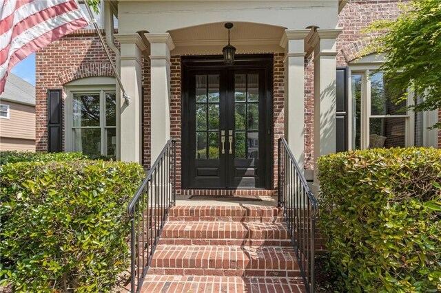 entrance to property with french doors and brick siding