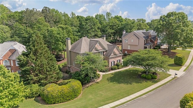 birds eye view of property with a residential view