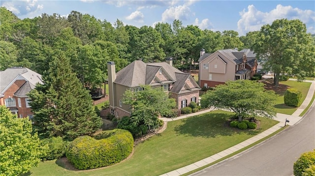 birds eye view of property with a residential view