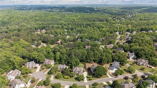 bird's eye view featuring a residential view and a forest view