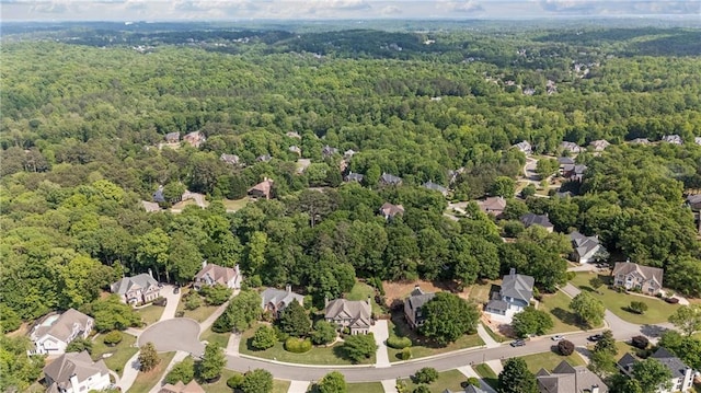 bird's eye view featuring a residential view and a forest view