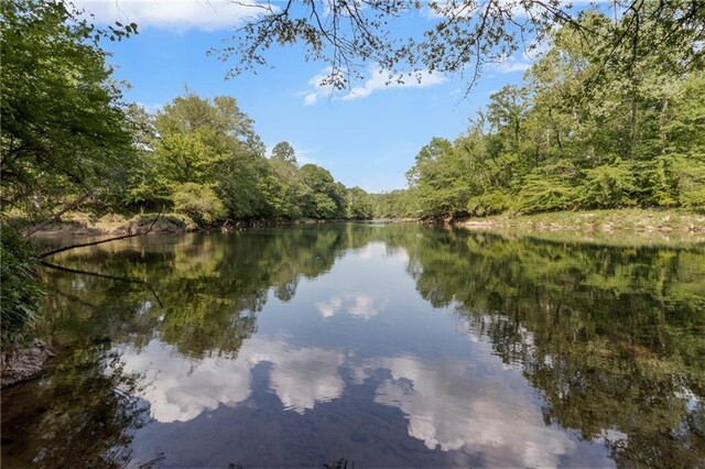 water view featuring a wooded view