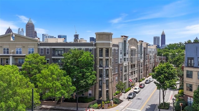 390 17th St NW Unit 6036, Atlanta, GA 30363 - view of building exterior featuring a view of skyline and uncovered parking