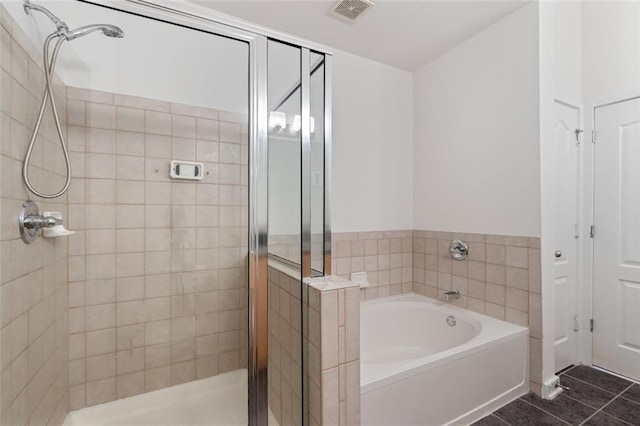 390 17th St NW Unit 6036, Atlanta, GA 30363 - full bathroom with a shower stall, a garden tub, and tile patterned floors