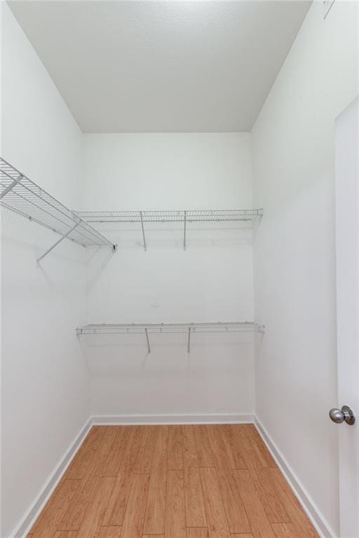390 17th St NW Unit 6036, Atlanta, GA 30363 - spacious closet featuring light wood-style flooring