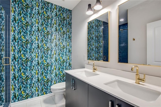 bathroom featuring walk in shower, vanity, toilet, and tile patterned floors