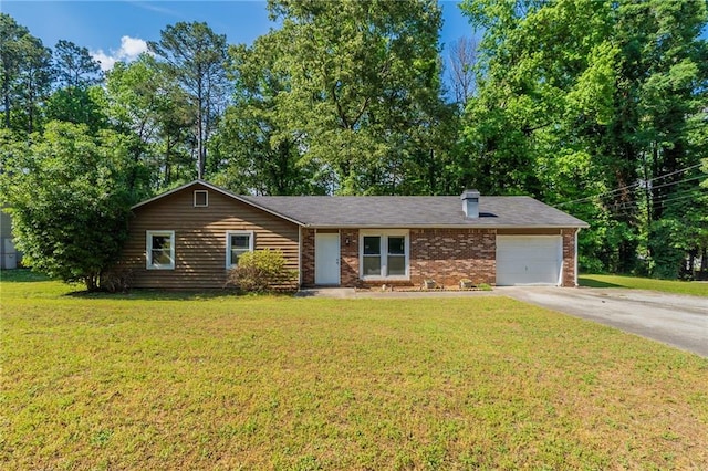 ranch-style home featuring an attached garage, a chimney, concrete driveway, a front yard, and brick siding