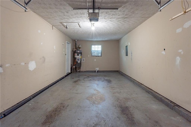 garage featuring gas water heater and a garage door opener
