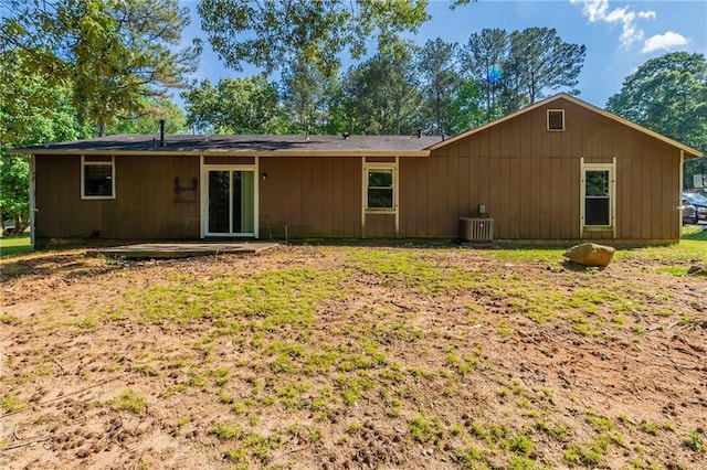 rear view of house with central air condition unit