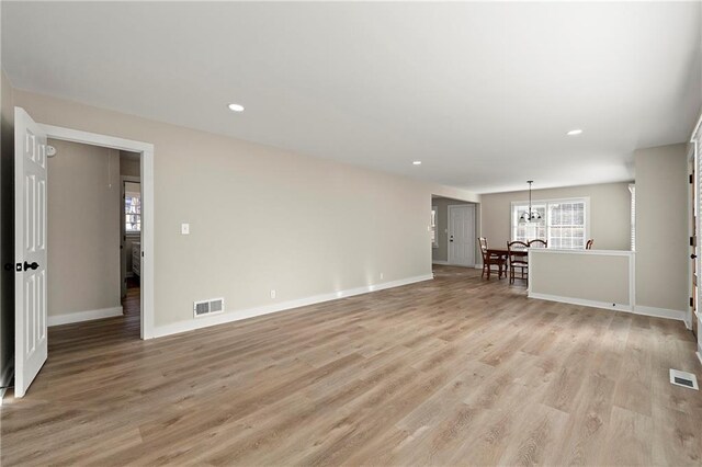 unfurnished living room featuring light wood-type flooring