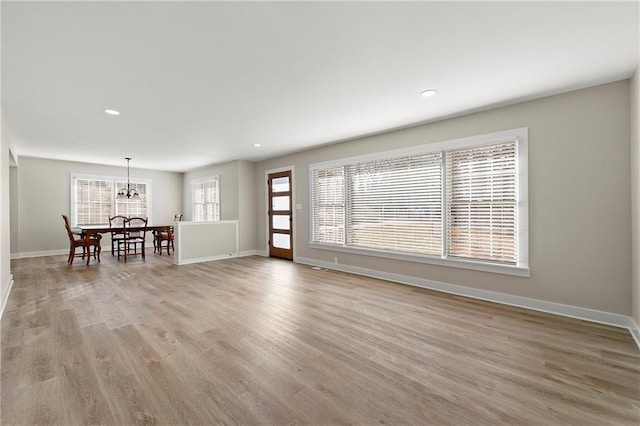 unfurnished living room featuring light hardwood / wood-style floors