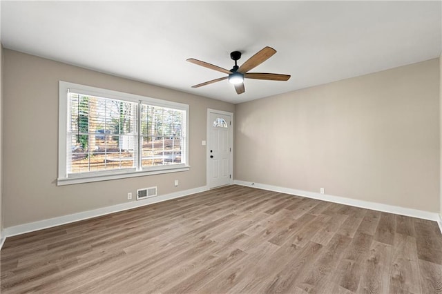 unfurnished room featuring light hardwood / wood-style flooring and ceiling fan