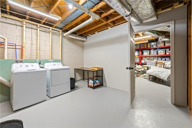 basement with washing machine and clothes dryer